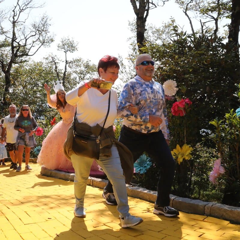 Two visitors enjoying the Yellow Brick Road at Land of Oz