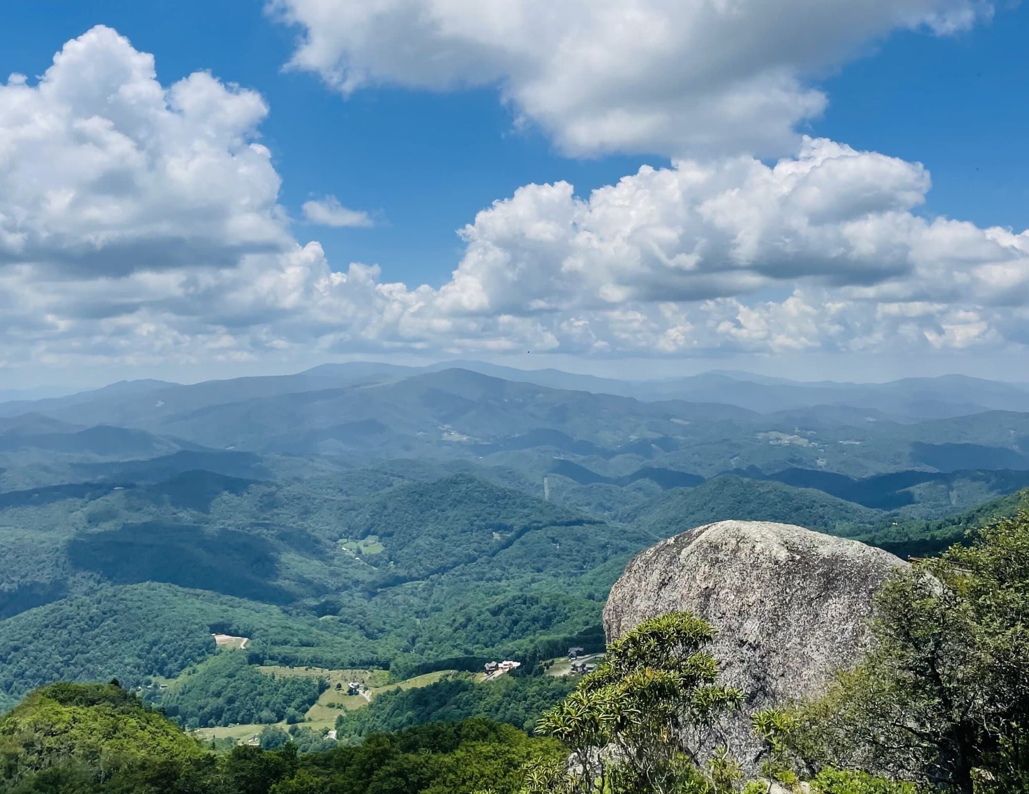Cumulus clouds over the Blue Ridge Mountains seen from Beech Mountain summit
